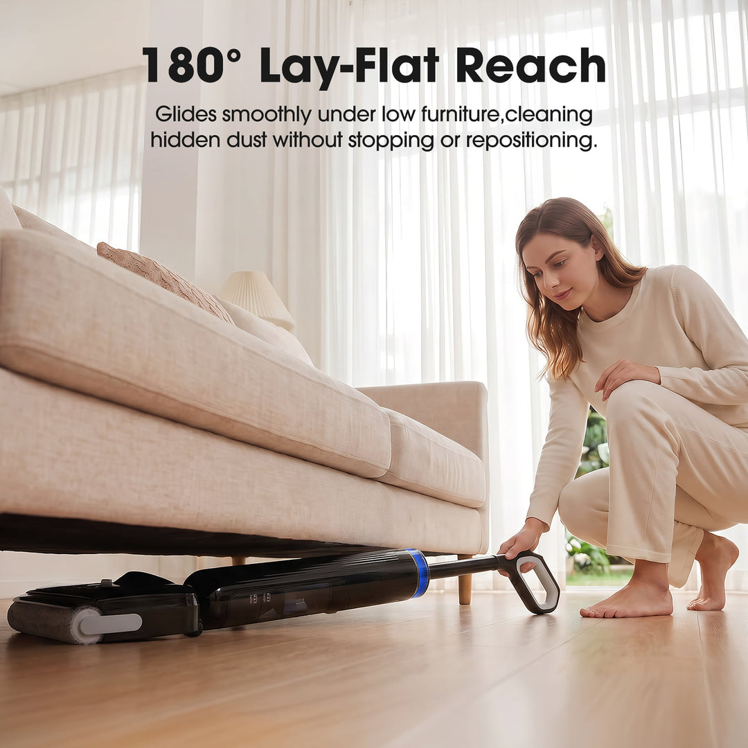 Woman using a vacuum cleaner with '180¡ã Lay-Flat Reach' feature under a couch.