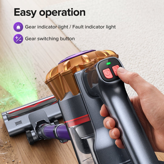 A handheld cordless vacuum cleaner being operated by a hand on a wooden floor, with overlaid text describing features like gear indicator light and gear switching button.